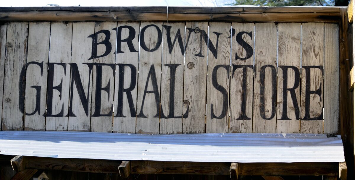 A wooden sign with the words "Brown's General Store" written on it